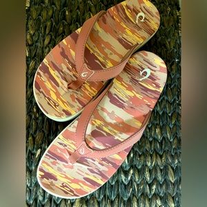 Never worn Olukai flip flops